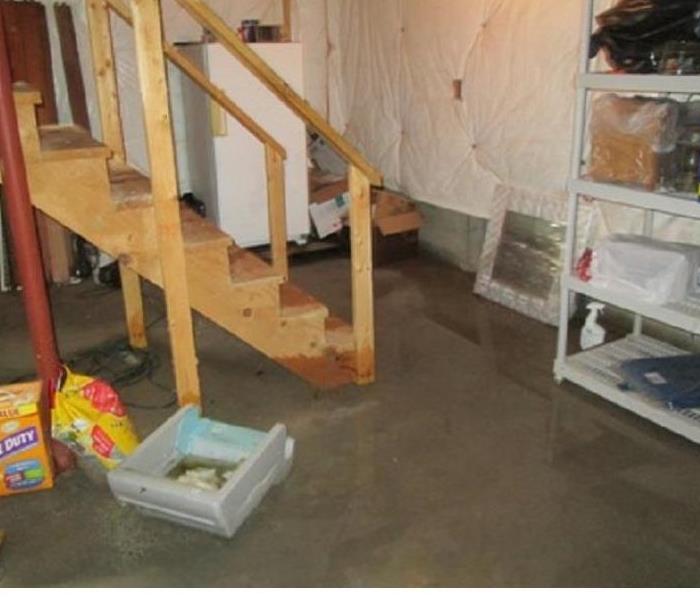 concrete basement floor covered with water