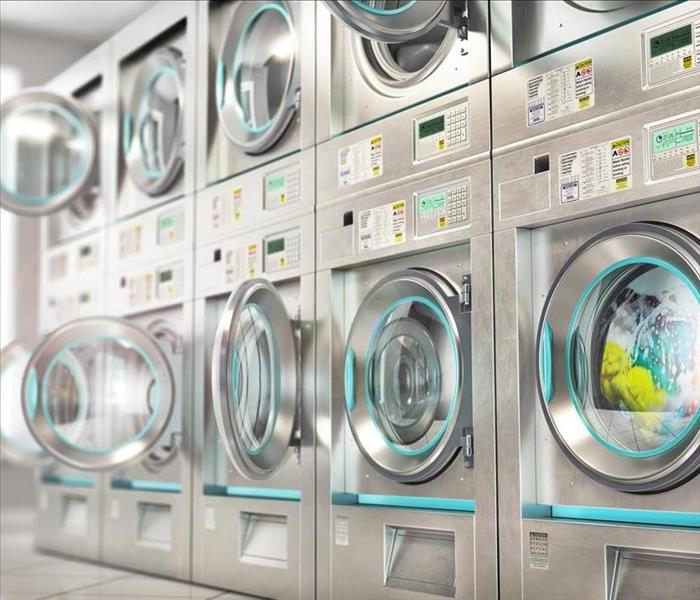 rows of washers in a laundromat